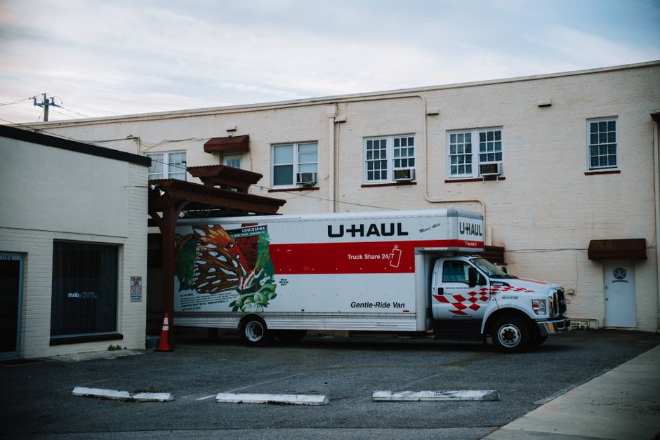 Moving truck parked outside a residential home
